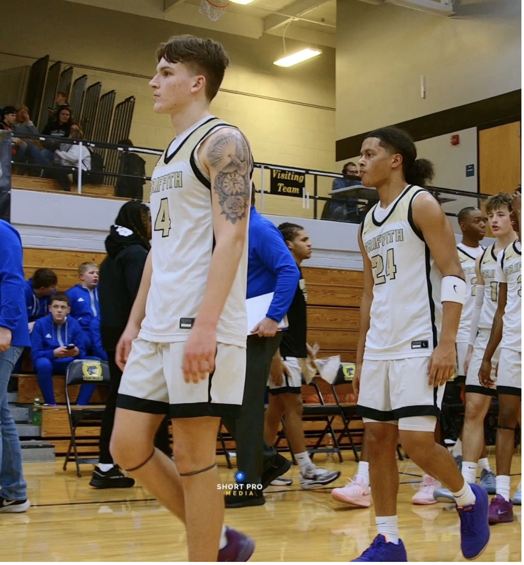 Colton Strezo and Gianni Feaster walk back to the huddle after a timeout from the Bluejays before the half against North Judson.